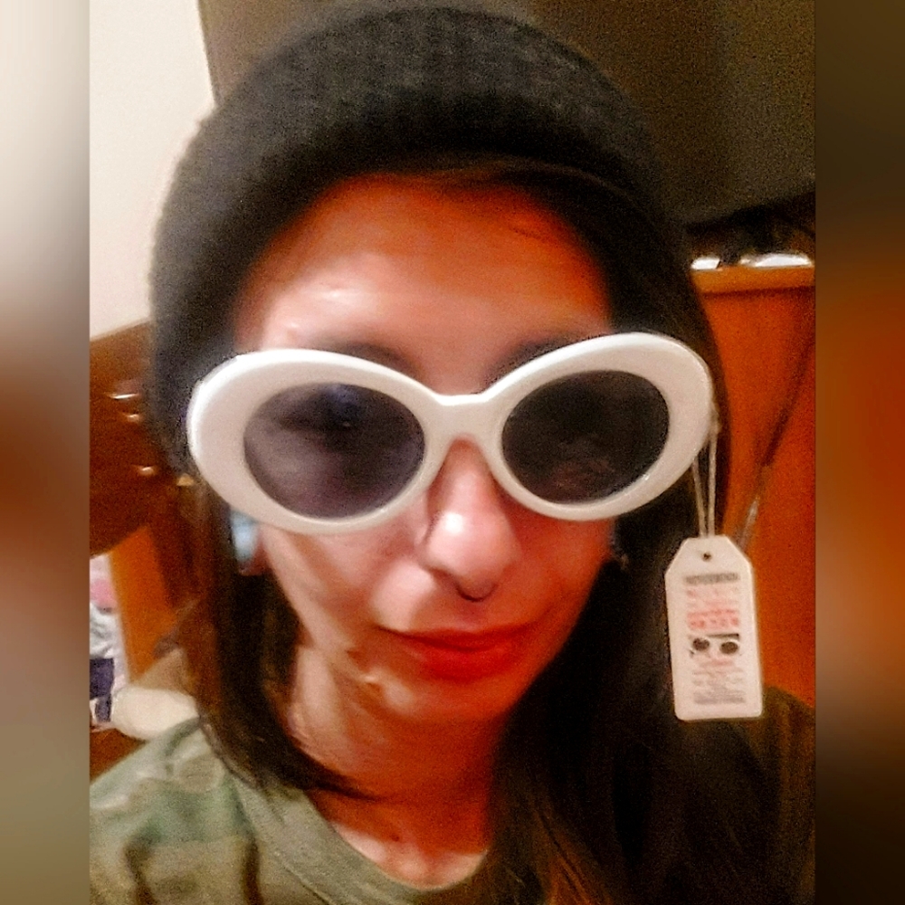 Petals and Peacocks 'Nevermind' sunglasses in white. NWT